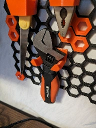 3d printing a tool wall at my desk. most of it is taken from printables but this hook I designed myself.