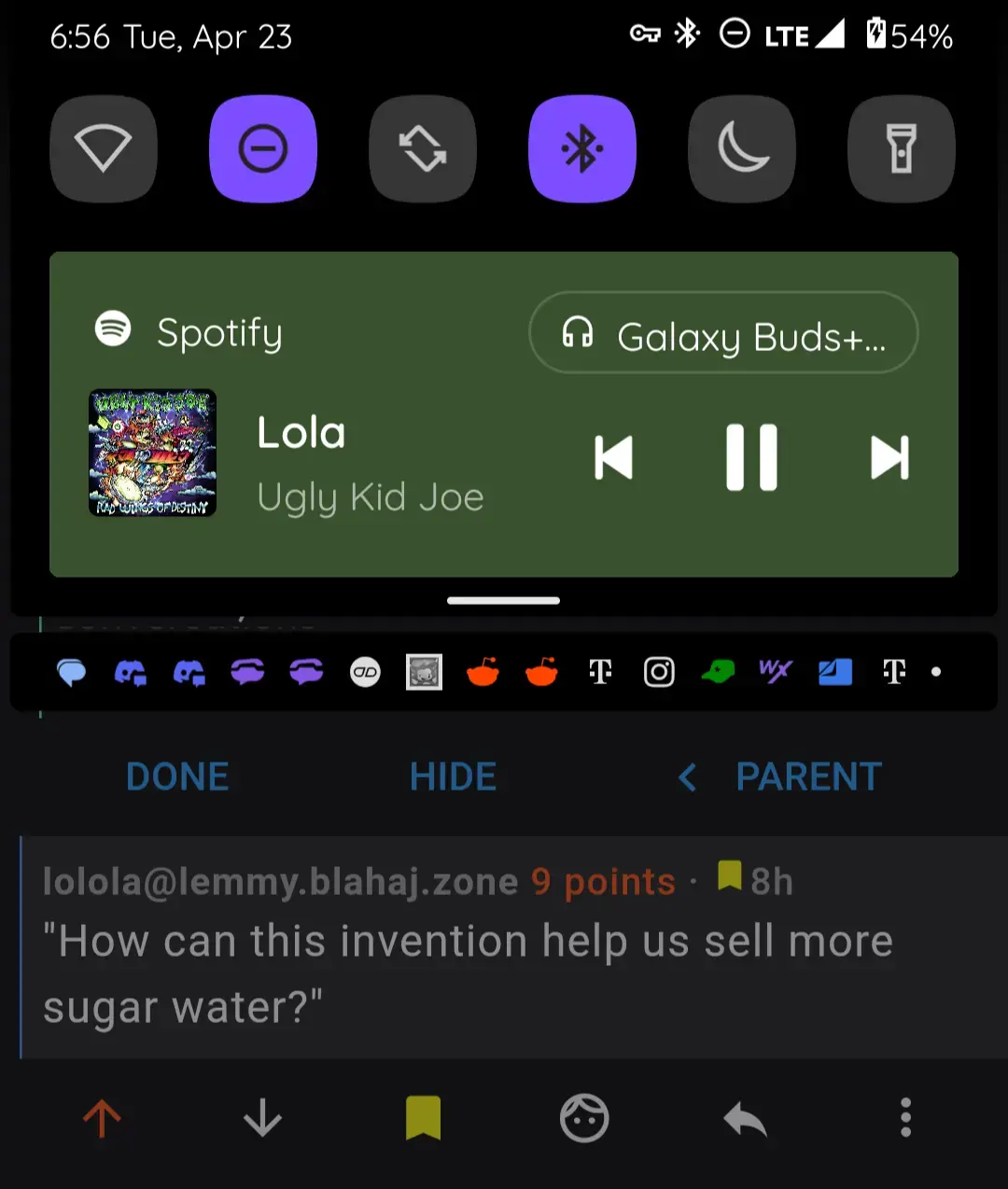 a smartphone screenshot showing what the commenter is listening to with lolola's comment in the background